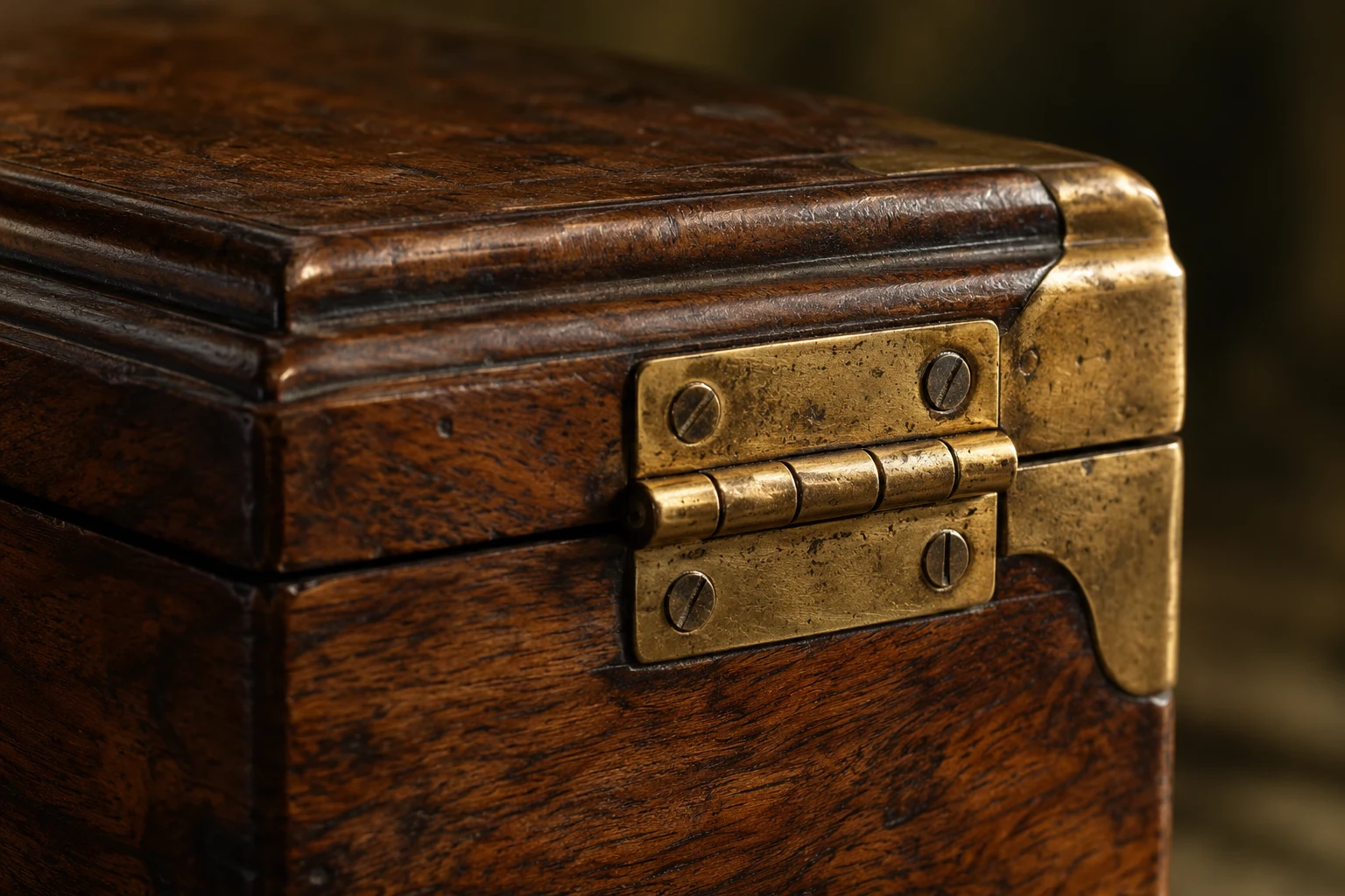 Illustrative close detail of an aged brass hinge and walnut wood grain.